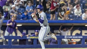 May 23, 2024; Hoover, AL, USA; LSU Tigers outfielder Jake Brown (18) scores the go ahead run on a single by LSU Tigers shortstop Michael Braswell (10) for an 11-10 lead over South Carolina Gamecocks during the SEC Baseball Tournament at Hoover Metropolitan Stadium. Mandatory Credit: Vasha Hunt-Imagn Images