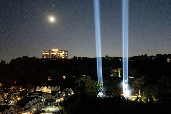 On the 23rd anniversary of the attacks on the World Trade Center in New York City, two towers of light push into the sky.
