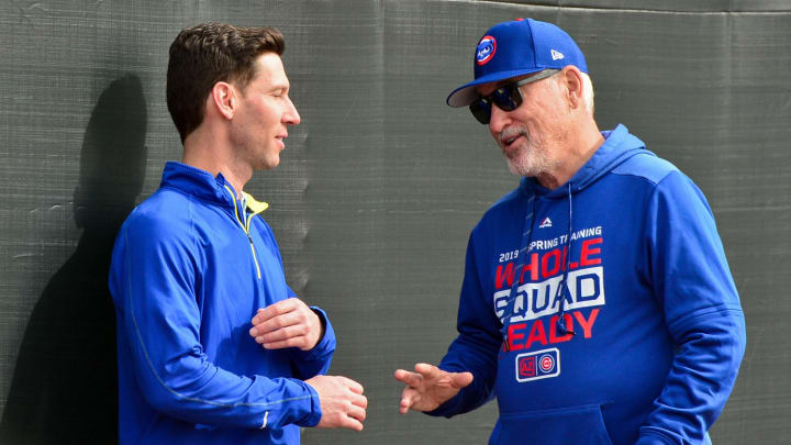 Feb 13, 2019; Mesa, AZ, USA; Chicago Cubs manager Joe Maddon (right) talks with director of strategic initiatives Craig Breslow during a spring training workout at Sloan Park. Mandatory Credit: Matt Kartozian-USA TODAY Sports