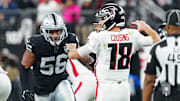 Dec 16, 2024; Paradise, Nevada, USA; Las Vegas Raiders linebacker Amari Burney (56) looks to sack Atlanta Falcons quarterback Kirk Cousins (18) during the third quarter at Allegiant Stadium. Mandatory Credit: Stephen R. Sylvanie-Imagn Images