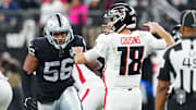 Dec 16, 2024; Paradise, Nevada, USA; Las Vegas Raiders linebacker Amari Burney (56) looks to sack Atlanta Falcons quarterback Kirk Cousins (18) during the third quarter at Allegiant Stadium. Mandatory Credit: Stephen R. Sylvanie-Imagn Images