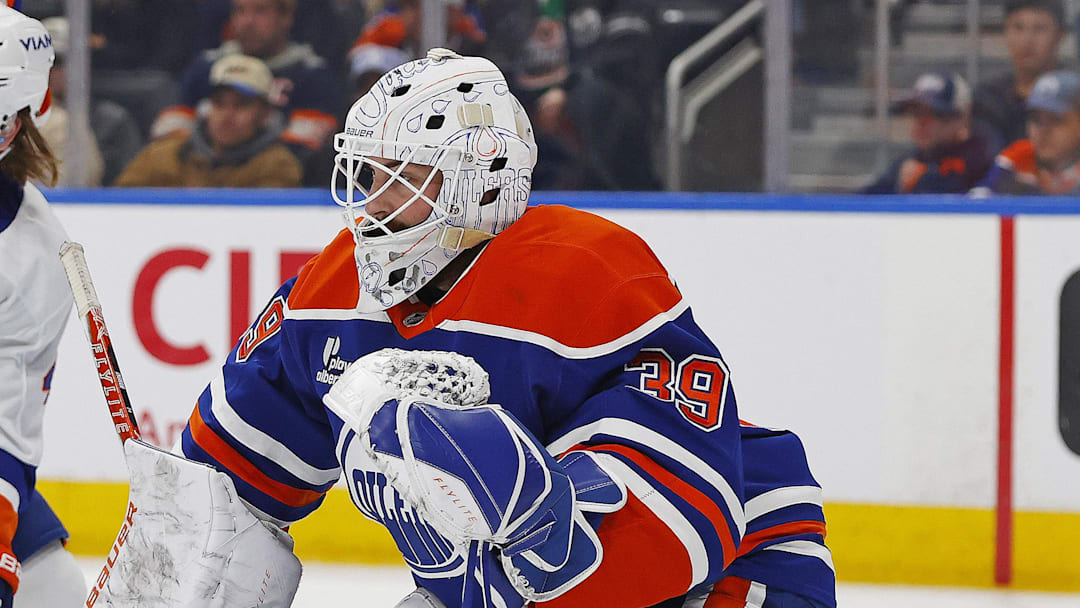 Jan 15, 2026; Edmonton, Alberta, CAN; New York Islanders forward Max Shabanov (49) and Edmonton Oilers defensemen Spencer Stastney (24) battle in front of goaltender Connor Ingram. This goaltender has his first shutout since joining the Edmonton Oilers. (39) during the second period at Rogers Place. Mandatory Credit: Perry Nelson-Imagn Images