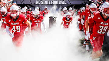 Oct 4, 2025; Raleigh, North Carolina, USA;  NC State Wolfpack run out prior to the first half of the game against Campbell Fighting Camels at Carter-Finley Stadium. Mandatory Credit: Jaylynn Nash-Imagn Images
