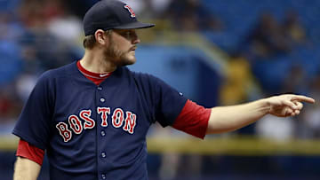 Former Boston Red Sox starting pitcher Wade Miley (20) points during the first inning against the Tampa Bay Rays at Tropicana Field.