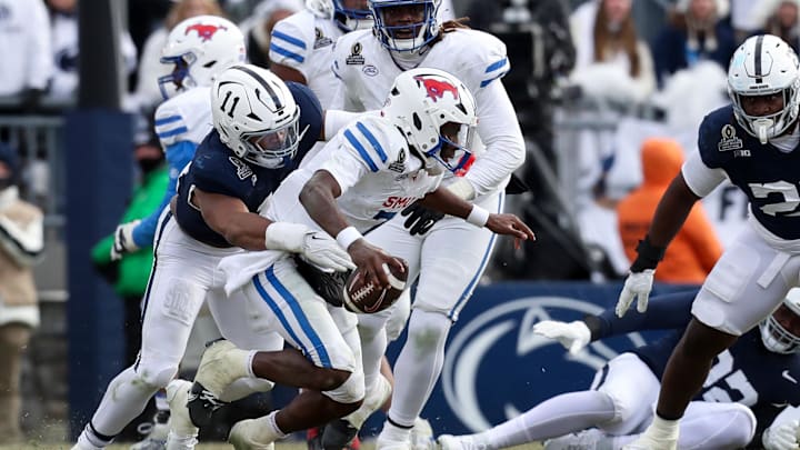 Dec 21, 2024; University Park, Pennsylvania, USA; Southern Methodist Mustangs quarterback Kevin Jennings (7) is sacked by Penn State Nittany Lions defensive end Abdul Carter (11) during the third quarter in the first round of the College Football Playoff at Beaver Stadium. Dec 21, 2024; University Park, Pennsylvania, USA; Southern Methodist Mustangs quarterback Kevin Jennings (7) is sacked by Penn State Nittany Lions defensive end Abdul Carter (11) during the third quarter in the first round of the College Football Playoff at Beaver Stadium.