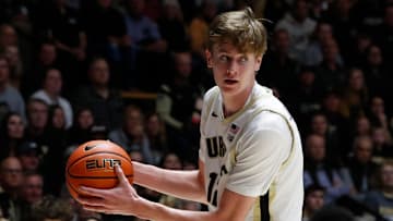 Purdue Boilermakers center Daniel Jacobsen (12) grabs a rebound 