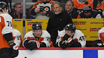 Dec 21, 2024; Philadelphia, Pennsylvania, USA; Philadelphia Flyers head coach John Tortorella behind the bench against the Columbus Blue Jackets during the second period at Wells Fargo Center. Mandatory Credit: Eric Hartline-Imagn Images
