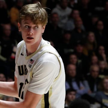 Purdue Boilermakers center Daniel Jacobsen (12) grabs a rebound 