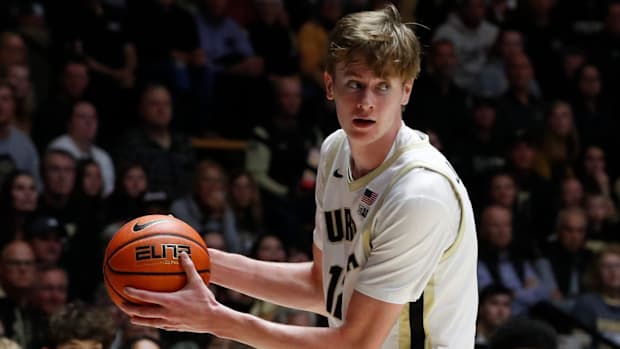 Purdue Boilermakers center Daniel Jacobsen (12) grabs a rebound 