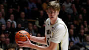 Purdue Boilermakers center Daniel Jacobsen (12) grabs a rebound 