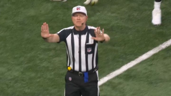 Referee Carl Cheffers calls offensive pass interference on Detroit Lions wide receiver Amon-Ra St. Brown.
