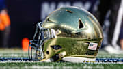Oct 26, 2024; East Rutherford, New Jersey, USA; A Notre Dame Fighting Irish helmets rests on the field before the game between the Fighting Irish and the Navy Midshipmen at MetLife Stadium. Mandatory Credit: Vincent Carchietta-Imagn Images