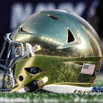 Oct 26, 2024; East Rutherford, New Jersey, USA; A Notre Dame Fighting Irish helmets rests on the field before the game between the Fighting Irish and the Navy Midshipmen at MetLife Stadium. Mandatory Credit: Vincent Carchietta-Imagn Images