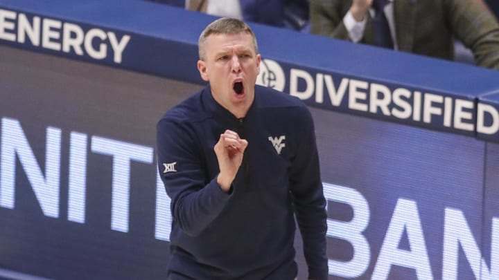 Mar 6, 2026; Morgantown, West Virginia, USA; West Virginia Mountaineers head coach Ross Hodge yells from the sideline during the first half against the UCF Knights at Hope Coliseum. Mandatory Credit: Ben Queen-Imagn Images