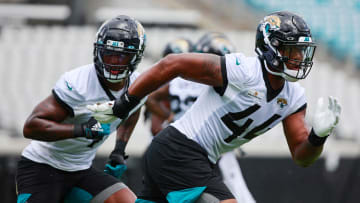 Jacksonville Jaguars outside linebacker Travon Walker (44) participates in an offseason running past outside linebacker Josh Allen (41) training activity Tuesday, May 31, 2022 at TIAA Bank Field in Jacksonville.