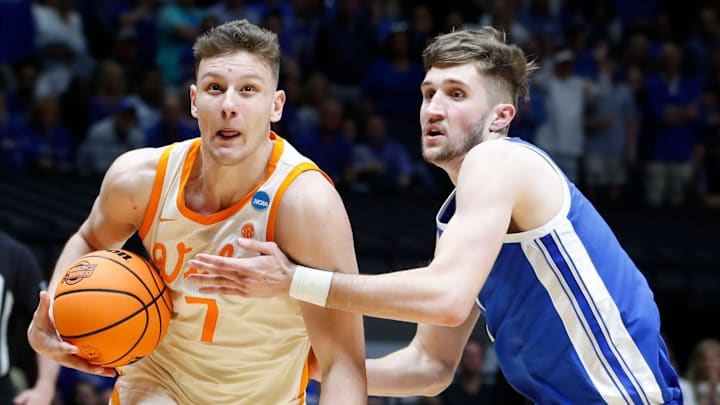 Tennessee Volunteers forward Igor Milicic Jr. (7) drives past Kentucky Wildcats forward Andrew Carr (7) Friday, March 28, 2025, during the NCAA Tournament Sweet 16 game at Lucas Oil Stadium in Indianapolis. Tennessee Volunteers forward Igor Milicic Jr. (7) drives past Kentucky Wildcats forward Andrew Carr (7) Friday, March 28, 2025, during the NCAA Tournament Sweet 16 game at Lucas Oil Stadium in Indianapolis.