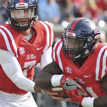 Nov 5, 2016; Oxford, MS, USA; Mississippi Rebels quarterback Jason Pellerin (7) hands the ball off to Mississippi Rebels running back Akeem Judd (21) during the second half against Georgia Southern Eagles  at Vaught-Hemingway Stadium. Mississippi Rebels defeated Georgia Southern Eagles 37-27. Mandatory Credit: Justin Ford-Imagn Images