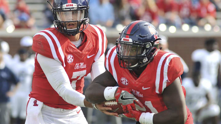 Nov 5, 2016; Oxford, MS, USA; Mississippi Rebels quarterback Jason Pellerin (7) hands the ball off to Mississippi Rebels running back Akeem Judd (21) during the second half against Georgia Southern Eagles  at Vaught-Hemingway Stadium. Mississippi Rebels defeated Georgia Southern Eagles 37-27. Mandatory Credit: Justin Ford-Imagn Images