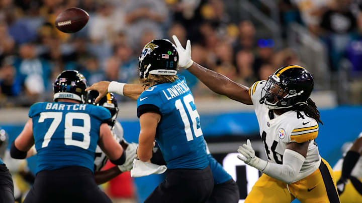 Jacksonville Jaguars quarterback Trevor Lawrence #16 throws the ball as Pittsburgh Steelers linebacker Hamilcar Rashed Jr. #46 pressures during the second quarter of an NFL preseason game Saturday, Aug. 20, 2022 at TIAA Bank Field in Jacksonville. [Corey Perrine/Florida Times-Union]

Jki 082022 Jags Vs Steelers Cp 118