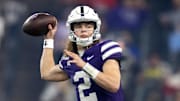 Dec 26, 2024; Phoenix, AZ, USA; Kansas State Wildcats quarterback Avery Johnson (2) against the Rutgers Scarlet Knights during the Rate Bowl at Chase Field. Mandatory Credit: Mark J. Rebilas-Imagn Images