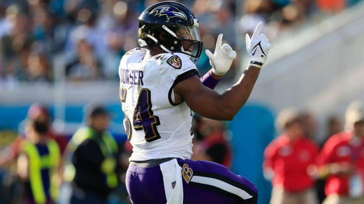 Baltimore Ravens linebacker Tyus Bowser (54) signals a first down pick up during the third quarter of a regular season NFL football matchup on Nov. 27, 2022 at TIAA Bank Field in Jacksonville. The Jaguars edged the Ravens 28-27. 