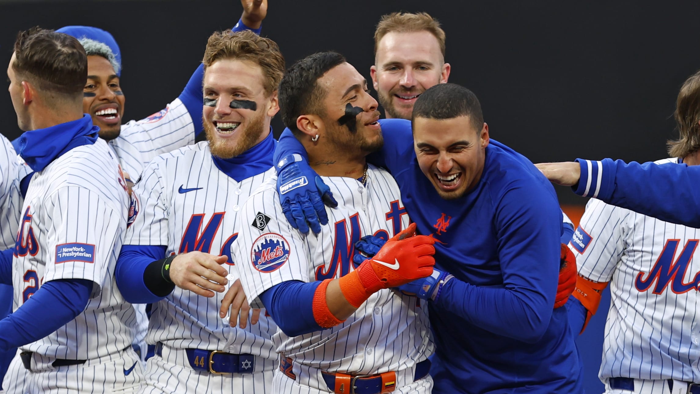 Tyrone Taylor celebrates a walk-off single with his teammates.