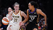 Jul 15, 2025; Boston, Massachusetts, USA; Indiana Fever guard Caitlin Clark (22) drives the ball against Connecticut Sun guard Leila Lacan (47) in the second quarter at TD Garden. Mandatory Credit: David Butler II-Imagn Images