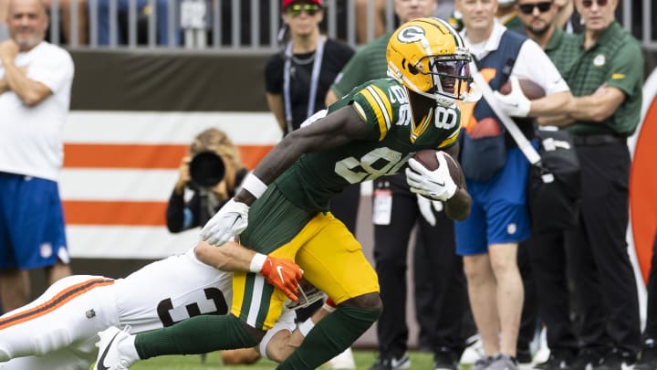 Aug 10, 2024; Cleveland, Ohio, USA; Green Bay Packers wide receiver Grant DuBose (86) runs the ball as Cleveland Browns safety Brady Breeze (39) tackles him during the first quarter at Cleveland Browns Stadium. Mandatory Credit: Scott Galvin-USA TODAY Sports