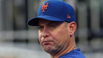 Sep 24, 2024; Atlanta, Georgia, USA; New York Mets manager Carlos Mendoza (64) in the dugout before a game against the Atlanta Braves at Truist Park. Mandatory Credit: Brett Davis-Imagn Images