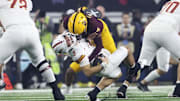 Arizona State defensive back Simmons tackles Iowa State quarterback Becht during the second half at AT&T Stadium.