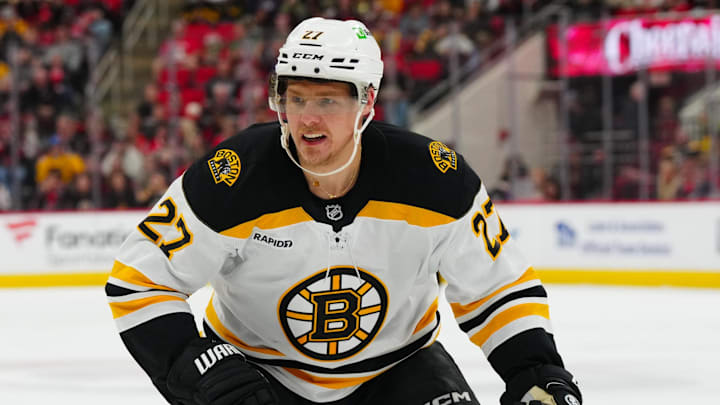 Oct 31, 2024; Raleigh, North Carolina, USA;  Boston Bruins defenseman Hampus Lindholm (27) skates against the Carolina Hurricanes during the third period at Lenovo Center. Mandatory Credit: James Guillory-Imagn Images