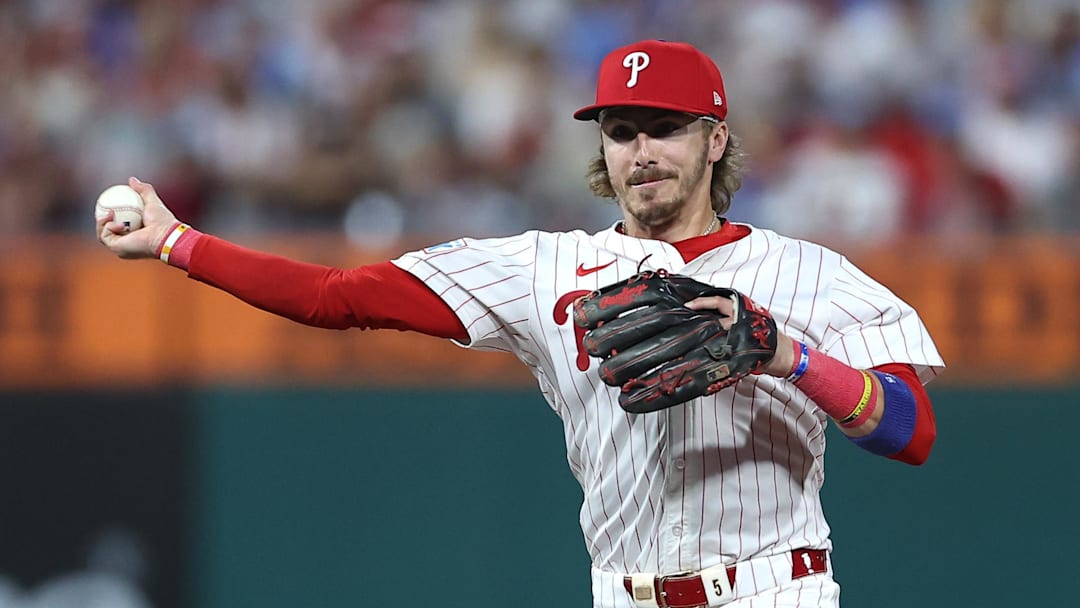 Philadelphia Phillies second baseman Bryson Stott (5) forces out Los Angeles Dodgers first baseman Freddie Freeman (5) at second base in the second inning during game one of the NLDS round for the 2025 MLB playoffs at Citizens Bank Park. 
