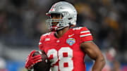 Dec 29, 2023; Arlington, Texas, USA; Ohio State Buckeyes running back TC Caffey (28) warms up prior to the Goodyear Cotton Bowl Classic against the Missouri Tigers at AT&T Stadium.