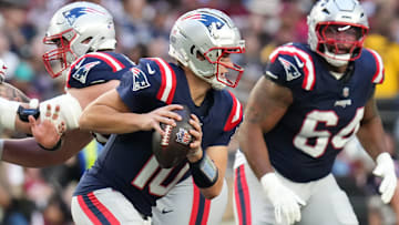 New England Patriots quarterback Drake Maye (10) scrambles out of the pocket against the Arizona Cardinals at State Farm Stadium on Dec 15, 2024.