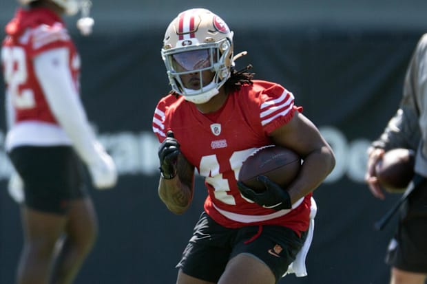 San Francisco 49ers running back Corey Kiner (49) runs a play from scrimmage during an OTA at Levi's Stadium.