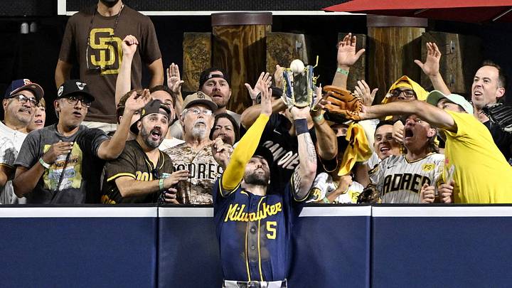 Milwaukee Brewers center fielder Garrett Mitchell catches a ball hit by San Diego Padres third baseman Manny Machado.