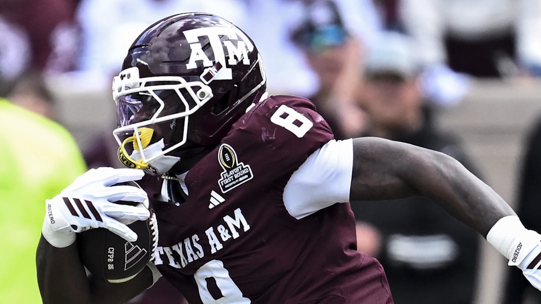 Dec 20, 2025; College Station, TX, USA; Texas A&M Aggies running back Le'Veon Moss (8) runs the ball against the Miami Hurricanes during the second half at Kyle Field. 