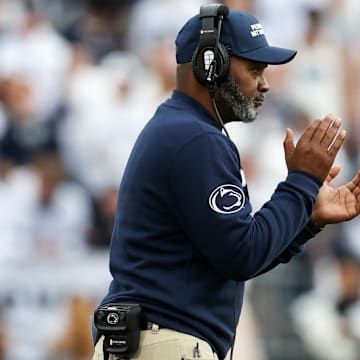 Penn State Nittany Lions head coach Terry Smith celebrates from the sideline during the third quarter against the Indiana Hoosiers at Beaver Stadium. 