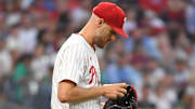 Jul 21, 2025; Philadelphia, Pennsylvania, USA; Philadelphia Phillies pitcher Zack Wheeler (45) checks the baseball after allowing a run during the sixth inning against the Boston Red Sox at Citizens Bank Park