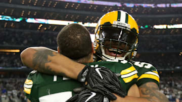 Julius Peppers embraces Nick Perry after the Packers won a playoff game at Dallas.