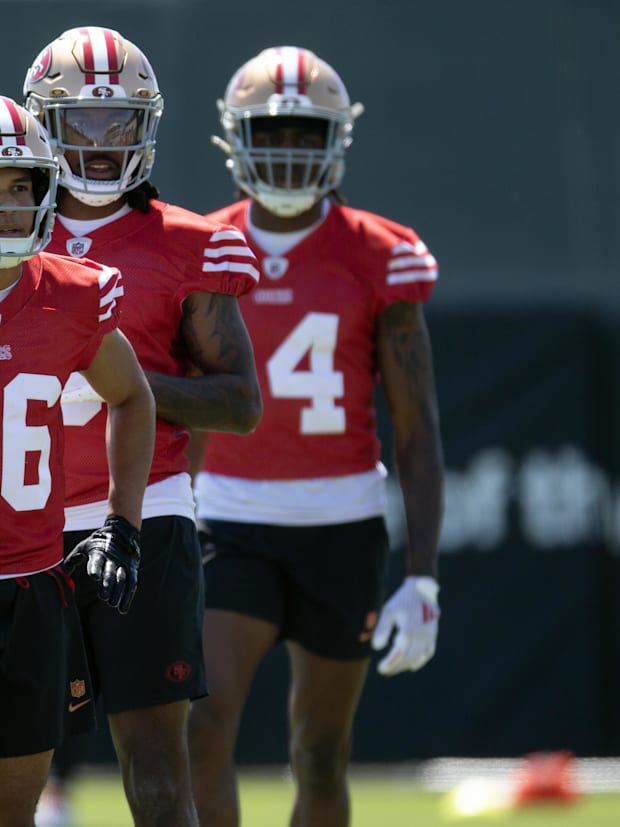 San Francisco 49ers wide receivers Jacob Cowing (19), Junior Bergen (86), Malik Knowles (3) and Isaiah Neyor (14) queue up fo