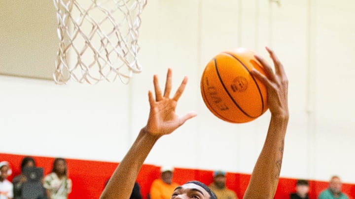 Gibbs High School center Isaiah Medina (1) takes it in for a layup in the first half. Gibbs High School played St. Thomas Aquinas in the championship game of the Kingdom of the Sun at Vanguard High School in Ocala, FL on Monday, December 30, 2024. St. Thomas Aquinas defeated the Raiders 80-64. [Doug Engle/Ocala Star Banner]