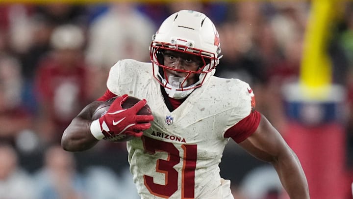 Arizona Cardinals running back Emari Demercado (31) breaks out of the backfield against the Seattle Seahawks at State Farm Stadium in Glendale on Sept. 25, 2025.