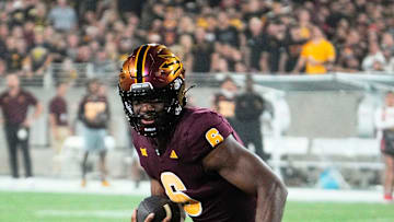 Arizona State Sun Devils quarterback Jeff Sims (6) runs for a touchdown against the Utah Utes in the first half at Mountain America Stadium.