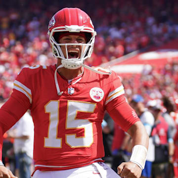 Aug 17, 2024; Kansas City, Missouri, USA; Kansas City Chiefs quarterback Patrick Mahomes (15) celebrates toward fans against the Detroit Lions prior to the game at GEHA Field at Arrowhead Stadium. Mandatory Credit: Denny Medley-Imagn Images