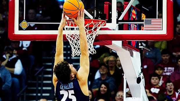 Liberty forward Zach Cleveland (25) scores during the second half of their game against Wisconsin