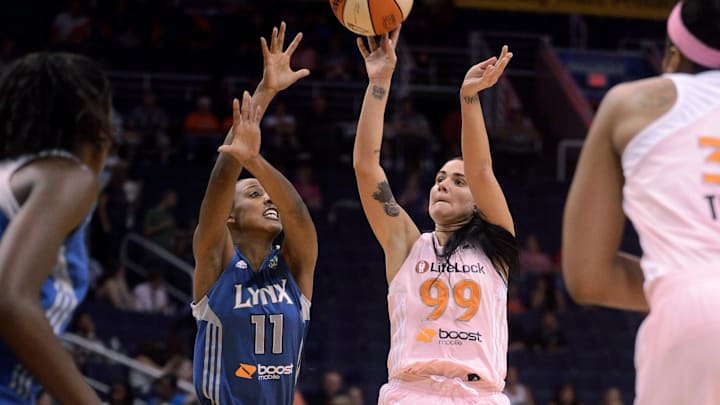 Sep. 21, 2012; Phoenix, AZ, USA; Phoenix Mercury guard Samantha Prahalis (99) puts up a shot against the Minnesota Lynx guard Candice Wiggins (11) in the first half at US Airways Center. Mandatory Credit: Jennifer Stewart-Imagn Images