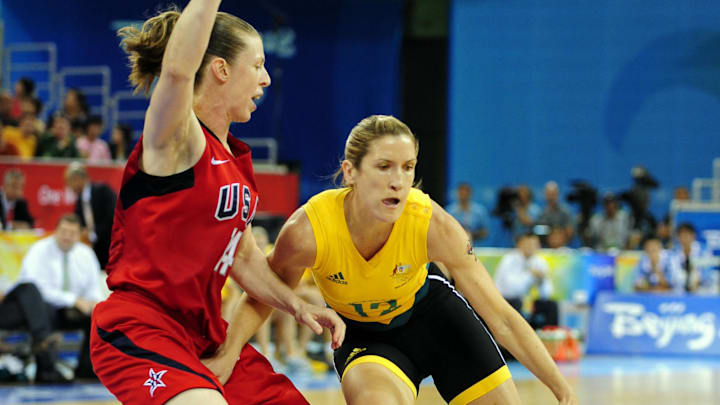 Aug 23, 2008; Beijing, CHINA; Australia forward Belinda Snell (12) drives against USA guard Katie Smith (14) during the women's basketball gold medal basketball game at the Beijing Olympic Basketball Gymnasium during the 2008 Beijing Olympic Games. USA defeated Australia 92-65 to win the gold medal. Mandatory Credit: Bob Donnan-Imagn Images Aug 23, 2008; Beijing, CHINA; Australia forward Belinda Snell (12) drives against USA guard Katie Smith (14) during the women's basketball gold medal basketball game at the Beijing Olympic Basketball Gymnasium during the 2008 Beijing Olympic Games. USA defeated Australia 92-65 to win the gold medal. Mandatory Credit: Bob Donnan-Imagn Images