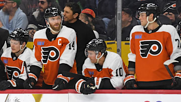 Apr 15, 2025; Philadelphia, Pennsylvania, USA; Philadelphia Flyers right wing Matvei Michkov (39), center Sean Couturier (14), right wing Bobby Brink (10) and right wing Tyson Foerster (71) watch the final seconds of loss to the Columbus Blue Jackets during the third period at Wells Fargo Center. Mandatory Credit: Eric Hartline-Imagn Images