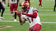 Dec 15, 2024; New Orleans, Louisiana, USA;  Washington Commanders wide receiver Terry McLaurin (17) celebrates a touchdown against the New Orleans Saints cornerback Kool-Aid McKinstry (14) during the first half at Caesars Superdome. Mandatory Credit: Matthew Hinton-Imagn Images